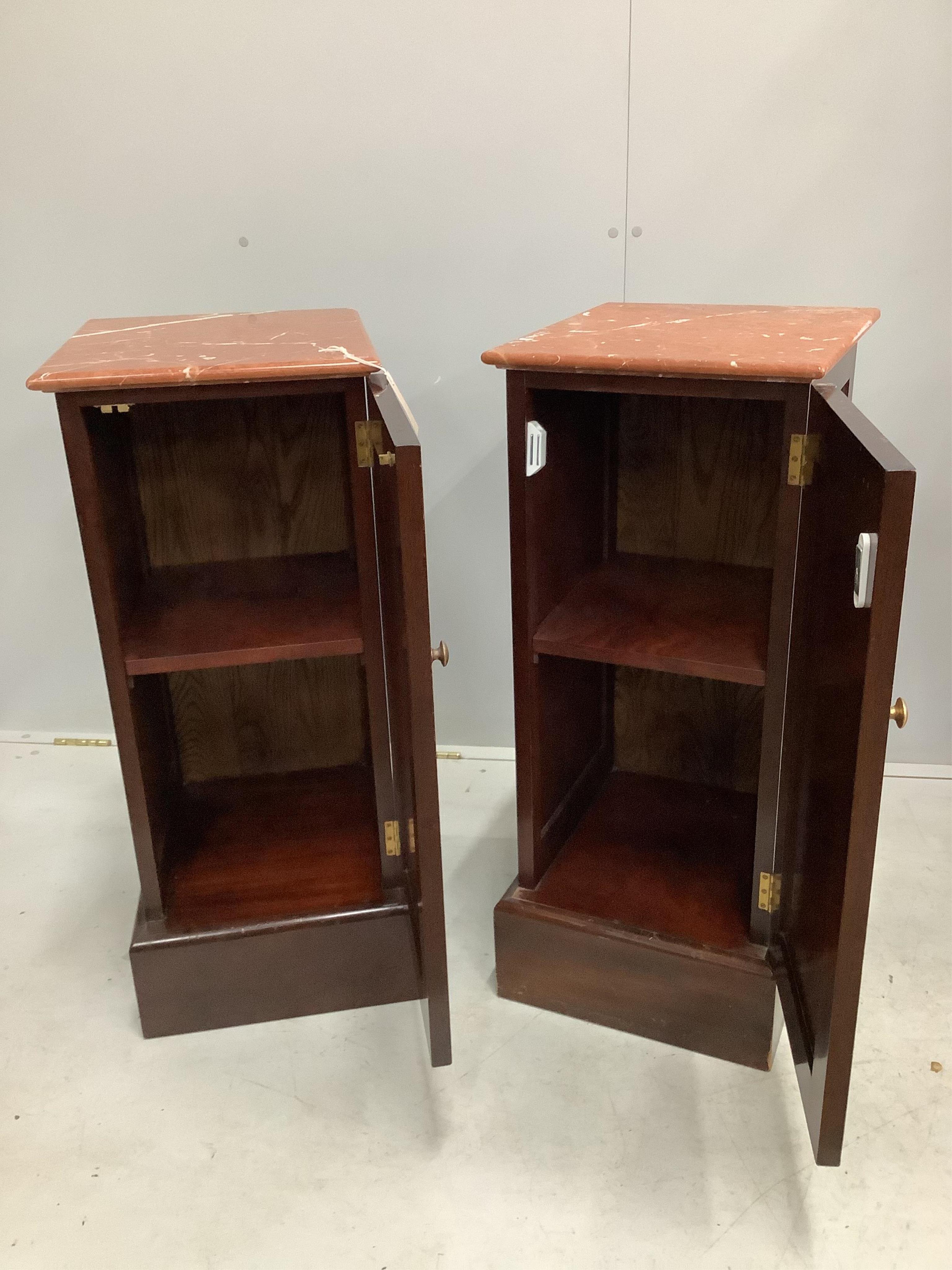 A pair of modern marble top mahogany bedside cupboards, width 36cm, height 85cm. Condition - good